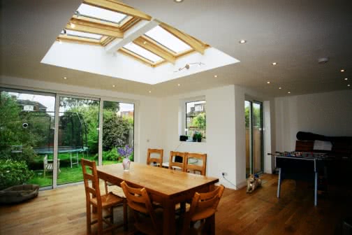table and chairs inside house extension